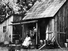 Mary Downen seated on the porch of her Mount Konocti cabin